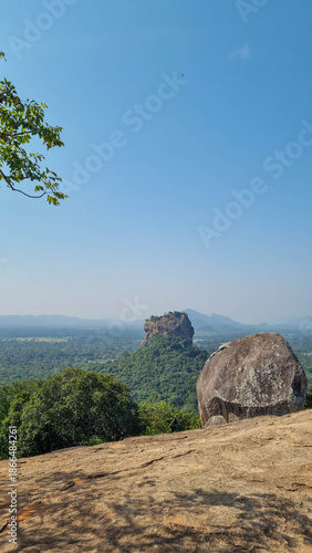 Iconic Sigiriya Rock surrounded by lush greenery. Sri Lanka.