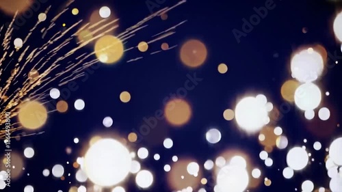 Golden and white sparkling particles floating and exploding on a dark blue background. Abstract elegant background for celebrations or events