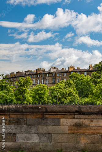 Edinburgh, Scotland, United Kingdom: roofs, palaces and the old town skyline, a glimpse of the ancient capital city seen from the Queensferry Road leading to Dean Village Dam
