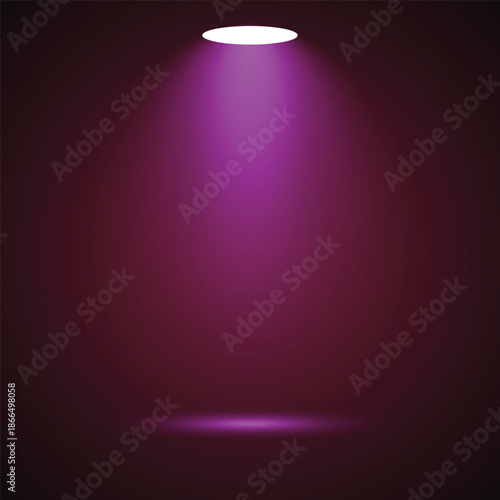 Pink spotlight shining down on dark background