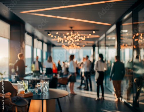 Soft blurred after-work office party with warm lights, colleagues socializing and relaxed corporate atmosphere. Ideal for team-building, workplace culture and informal professional events.