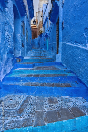 Narrow, stepped, pedestrian passageway linking the different levels of the medina, painted as is customary in shades of blue. Chefchaouen-Morocco-036