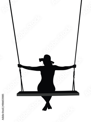 Silhouette of a woman on a swing