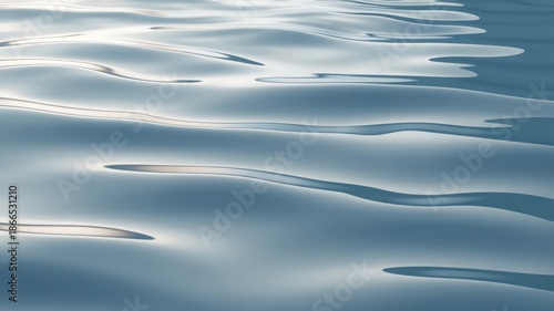 Calm ocean surface with gentle waves and sunlight reflections