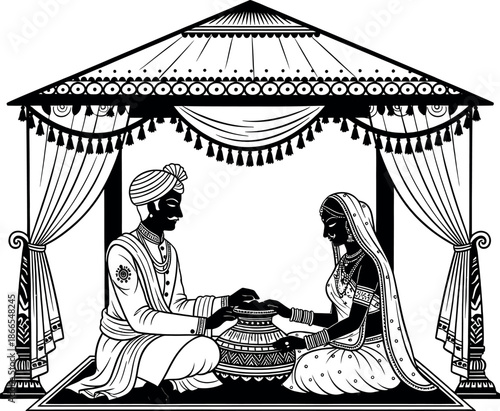 Traditional indian couple in a decorative pavilion exchanging vows in a hindu wedding ceremony