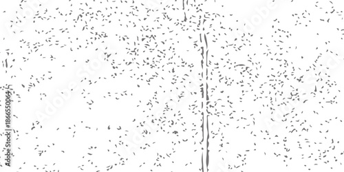 A transparent pattern of fresh rain drops and liquid droplets creates a clean texture on the wet glass window against the sky