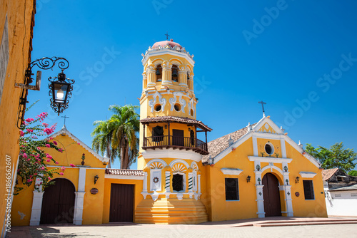 Wallpaper Mural The beautiful historic Church of Santa Barbara built in 1613 with a balcony on its bell tower at the colonial Heritage Town of Santa Cruz de Mompox in Colombia. Torontodigital.ca