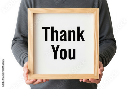 Person holding a wooden framed sign with thank you