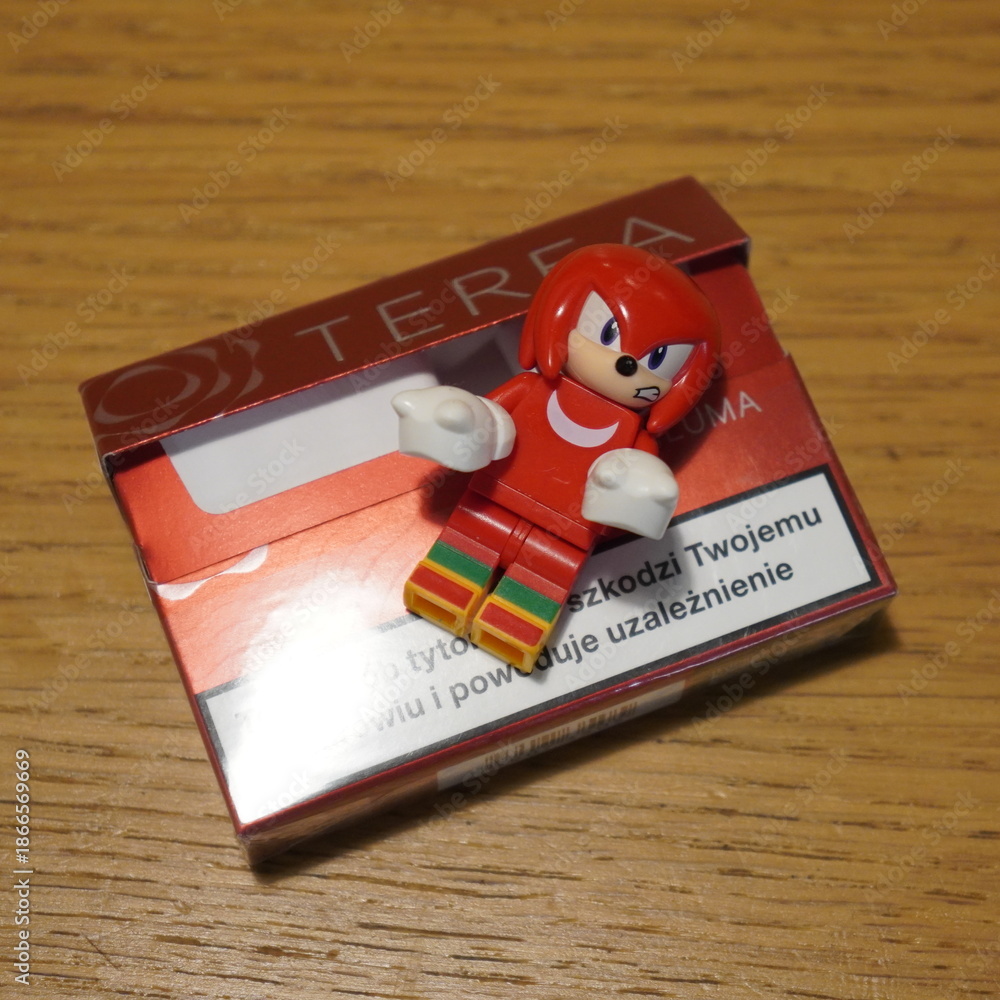 Obraz premium Red Lego Knuckles character toy on a pack of Terea tobacco sticks