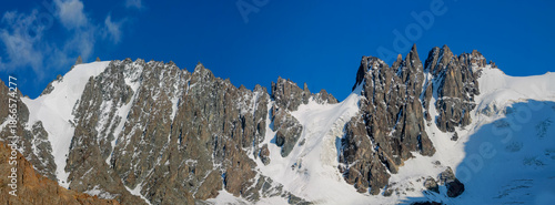 Photos Tuyuk Su Valley mountain landscape in Kazakhstan with snow capped peaks, rocky slopes, and glacial terrain near Almaty