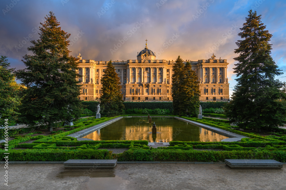 Fototapeta premium Sunset view of Royal Palace of Madrid and Sabatini Gardens in Madrid, Spain. Architecture and landmark of Madrid.