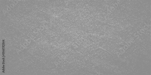 A closeup of textured white snow on a window and wall surface with a rough gray cement pattern and light grunge material design