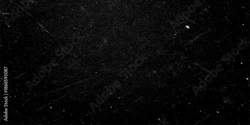 An abstract pattern of a white spider web stretches across a dark universe like a galaxy of dust and stars in the black night sky