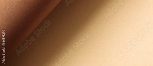 Minimalist Abstract Background with Curled Brown Paper over Beige Surface with Shadow
