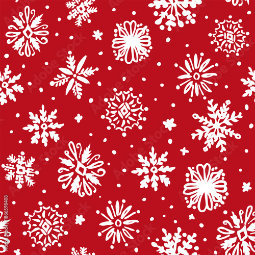 All over seamless repeat pattern with hand drawn ornate white snowflakes tossed on red background. Christmas wrap, gift bags, packaging, gift tags surface pattern design.