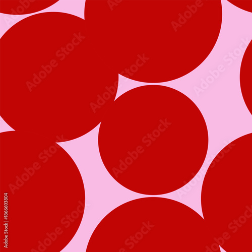 Seamless vector repeat pattern with jumbo scale big red polka dots tossed on a pink ground. Cheerful versatile cherry red surface design for Valentines, girls, romantic gift wrap and more