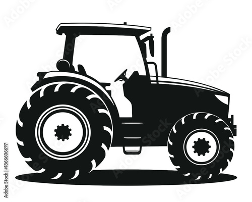 A black silhouette of a tractor with large wheels and a cab, set against a white background.
