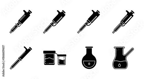 Collection of laboratory equipment including syringe test tubes and beakers