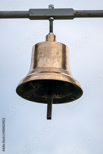 Hanging brass bell for religious purposes