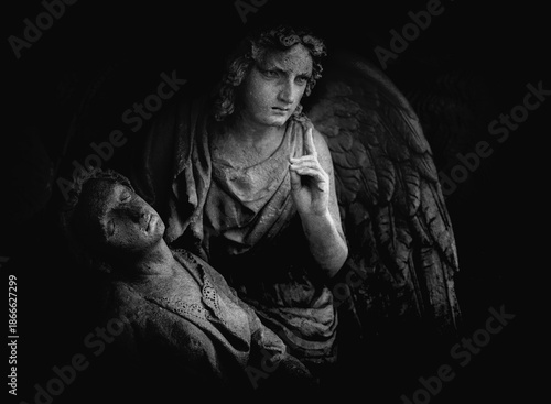 Angel of death statue symbolizing mortality, grief, final judgment, and the silent passage between life and eternity.