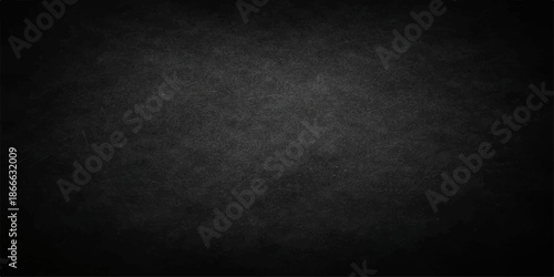 Blank vintage dark grunge background with a textured black concrete wall surface and empty copy space for old gray stone pattern design