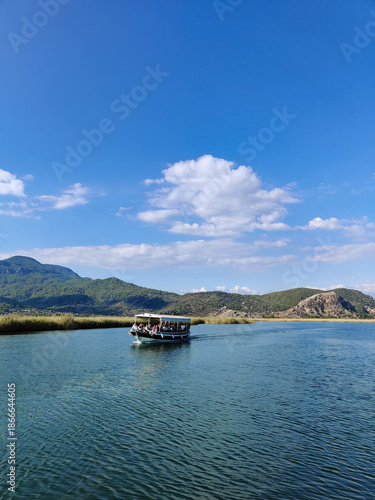 a beautiful ship is sailing in the blue sea