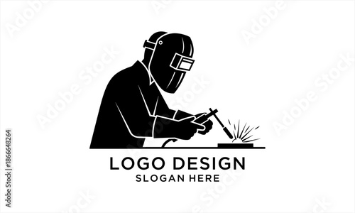 Skilled Welder in Protective Gear Performing Welding Work.