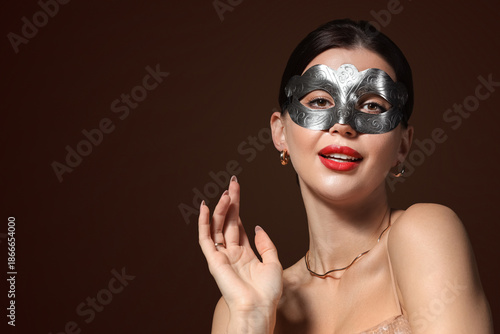 Pretty young woman in silve...