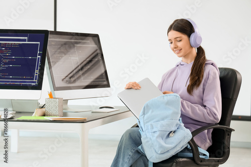 Female student in headphone...