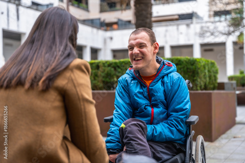 Schilderij op canvas Happy man with disability enjoying outdoor conversation