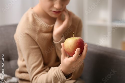 Little boy with apple suffe...