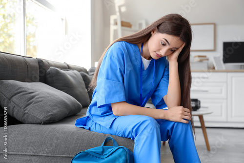 Tired female medical intern...