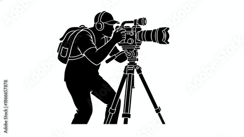 Professional Videographer Silhouette with Video Camera on Tripod and Headphones