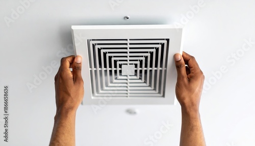 Person Installing Air Vent on Ceiling