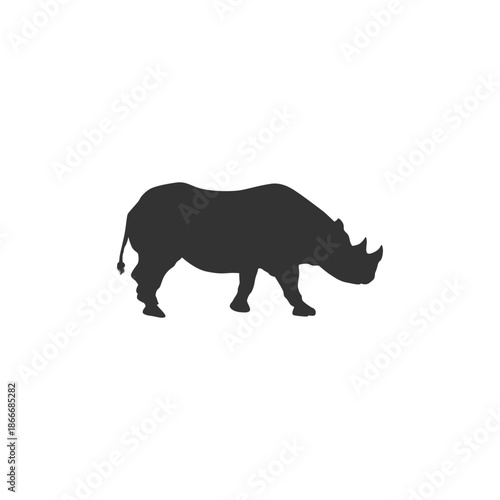 Gray rhinoceros silhouette walking in profile view