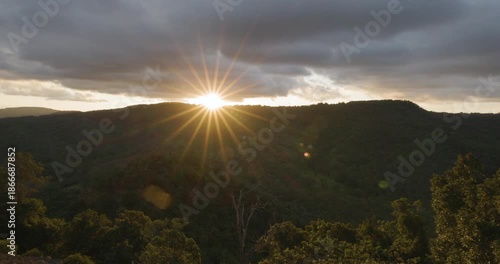 Scenic panoramic sunset views with starburst effect from Table Top Mountain lookimng towards Picnic Point park, Toowoomba, Queensland, Australia