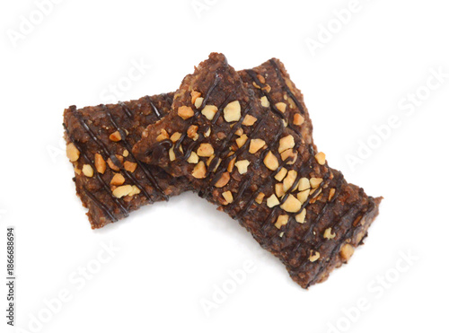 Honey bars with peanuts on white background