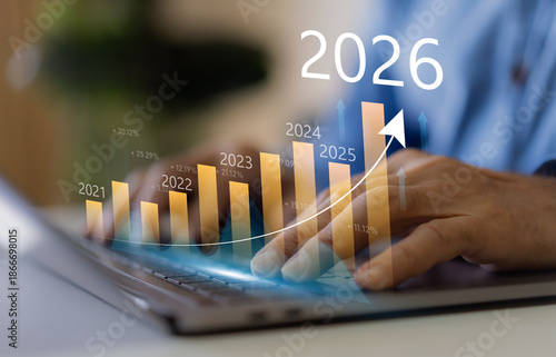 Businessman with digital arrow graph with 2026 year number, business growth, financial plan and strategy for new year 2026, marketing and profit, corporate future success and development concept