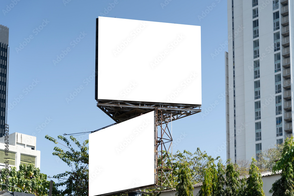 Fototapeta premium Blank Billboard Mockup in City with Blue Sky for Outdoor Advertising