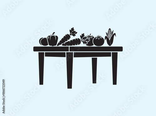 Solid black dining table silhouette with fruit and vegetable basket

