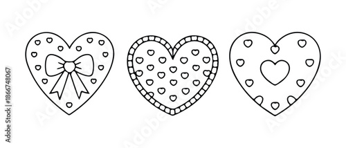 Set of three hand drawn outline heart shaped cookies decorated with bows and small hearts isolated on white