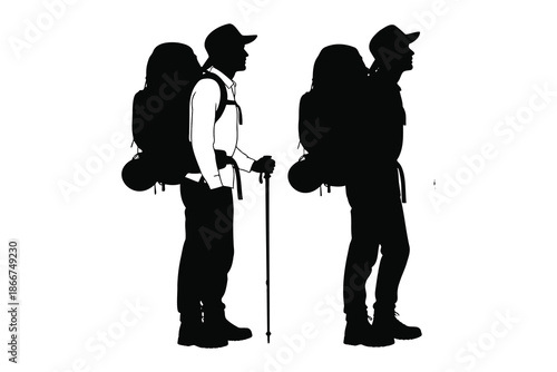 Two hikers with backpacks and walking stick standing side by side in profile view