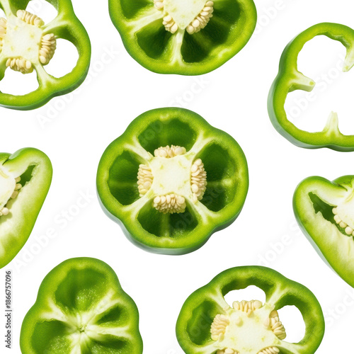 Vibrant green bell pepper slices, various rings and halves, one showing internal seeds, on a transparent background with copy space, top-down macro shot. Concept of fresh organic produce