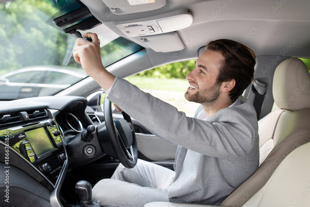Ταπετσαρία Man sitting in car and adjusting rearview mirror, car interior, road to office