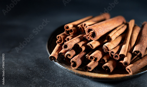 Wallpaper Mural cinnamon sticks on black background Torontodigital.ca