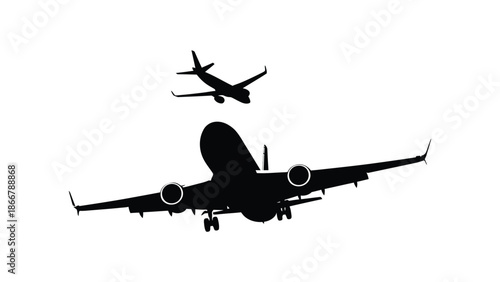 Two airplanes are flying in the sky, one larger than the other.