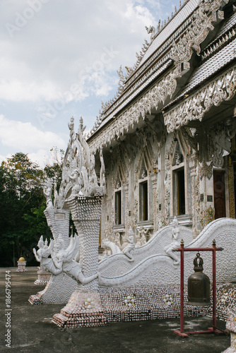 Beautiful exterior of Wat Phu Nam Ron Ratchaburi. This Thai Buddhist temple is known for its ornate white design and unique artistic decoration.