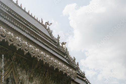 Beautiful exterior of Wat Phu Nam Ron Ratchaburi. This Thai Buddhist temple is known for its ornate white design and unique artistic decoration.