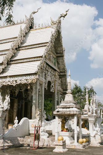 Beautiful exterior of Wat Phu Nam Ron Ratchaburi. This Thai Buddhist temple is known for its ornate white design and unique artistic decoration.