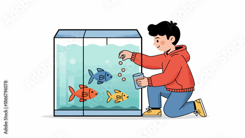 Young boy kneeling by aquarium watching colorful fish.